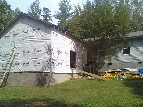 Tyvek wrapped gable on a new room addition beside an existing home in Detroit Lakes